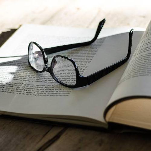 glasses on top of a book