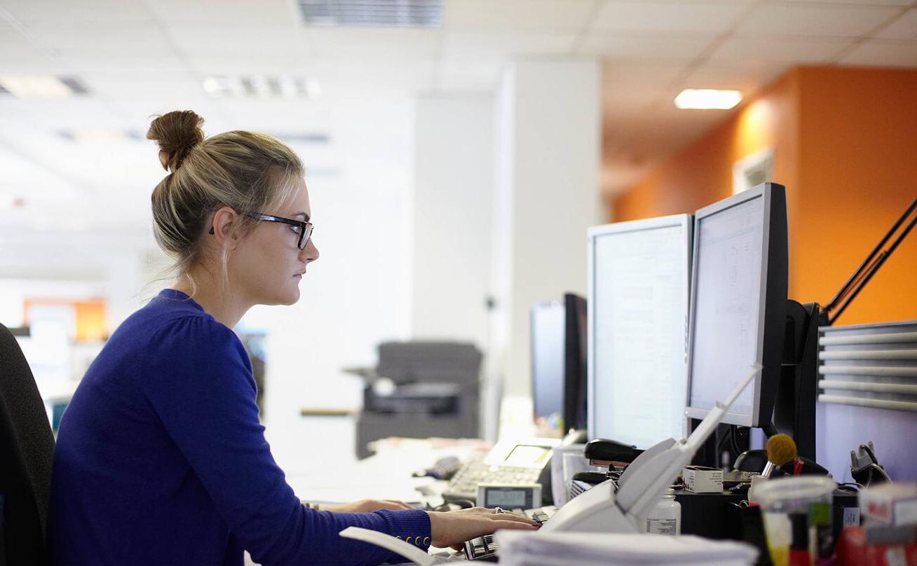 Young woman in front of computer at work